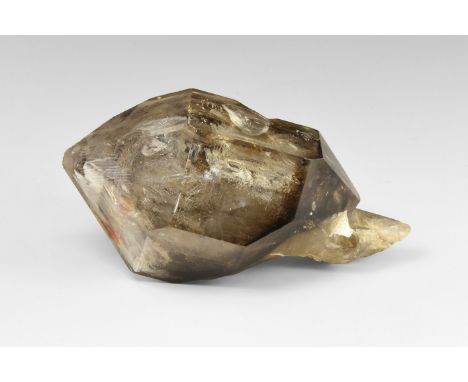 A very unusual, large, double-terminated fenster smoky quartz, with additional smaller crystals. Some of the hollows are liqu