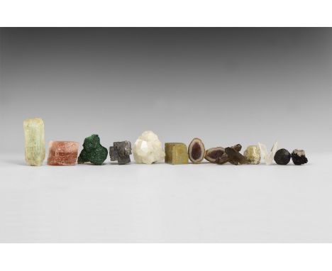 A group of twelve collectable mineral specimens including: quartz crystal cluster, grossular garnet, mini geode pair, beryl, 