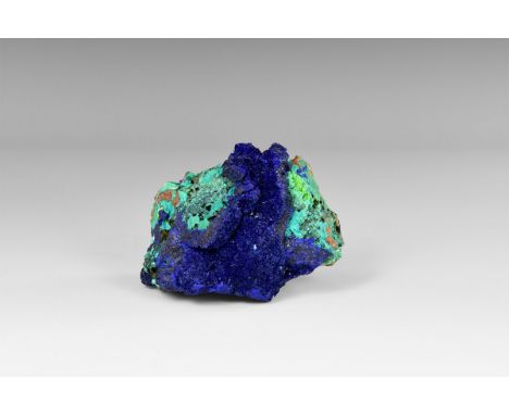 A band of well-crystallised and richly coloured azurite crystals on a matrix of chrysocolla and an unidentified opalized mate