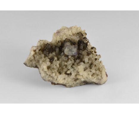 A specimen of chalybite (synonym: siderite) consisting of a number of spherical aggregates of chalybite crystals resting on a
