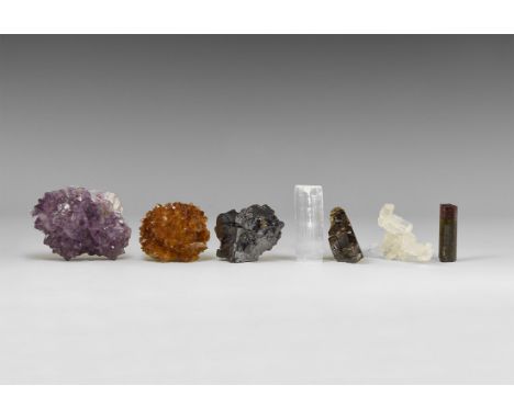 A group of seven mineral specimens consisting of rutile, a citrine 'porcupine', an amethyst 'porcupine', galena with sphaleri
