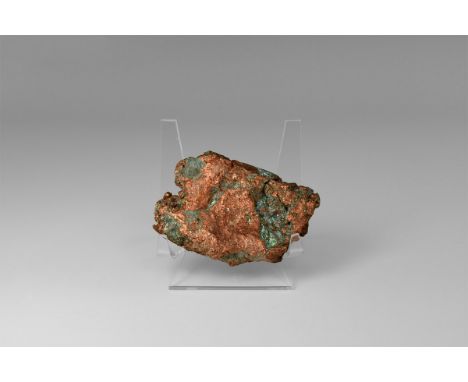 A nugget of float copper from Michigan, USA, with exposed copper and blue-green atacamite alteration products. Found Michigan
