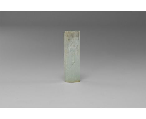 A perfectly formed, double terminated aquamarine crystal from Pakistan, in old white card tray with old Gregory, Bottley and 