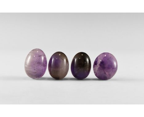 A group consisting of three amethyst eggs and a very thick amethyst cabochon finished to a good standard. From the historic ‘