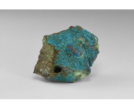 A specimen consisting of a crust of botryoidal and crystalline chalcanthite on a rock groundmass, in old white card tray with