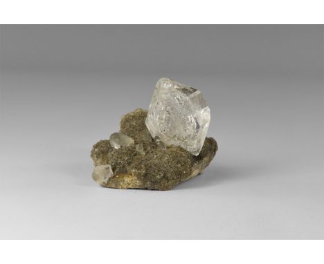 A double-terminated beta-quartz crystal on matrix, from Herkimer Co., New York, a so-called 'Herkimer Diamond', in old white 