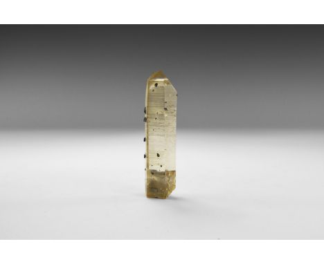 A unusual specimen of anatase crystals developed on the outside of a light smoky quartz crystal, from Norway, in old white ca