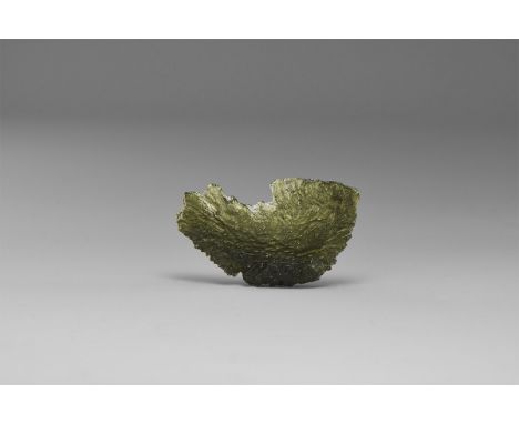 A fine transparent, bottle-green moldavite specimen showing good ablation features, in old white card tray with old Gregory, 