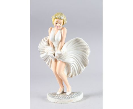 A PAINTED CAST IRON MARILYN MONROE. 13ins high.