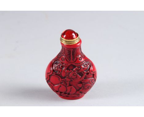 A CINNABAR SNUFF BOTTLE.