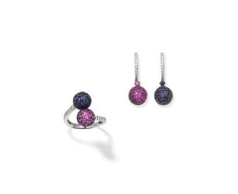 SAPPHIRE, RUBY AND DIAMOND RING AND EARRING SUITEThe ring obliquely-set with two circular-cut ruby and sapphire spheres, the 