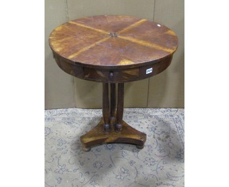 A 19th century mahogany drum table, the quart veneered inlaid top, over four frieze, raised on three turned supports, 73cm hi