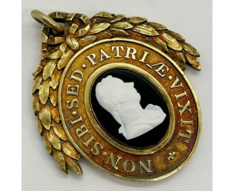 London Pitt Club an oval silver gilt members badge showing a cameo portrait of William Pitt, by Tassie on black glass set wit