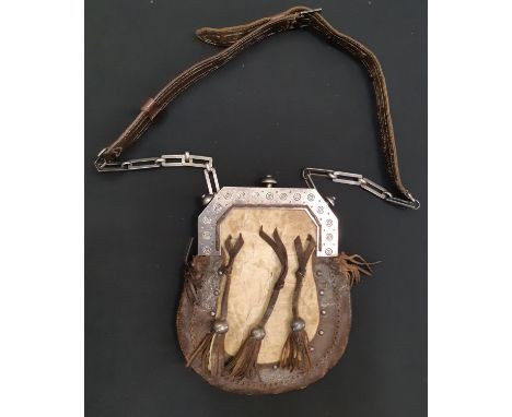 A Scottish Sporran with brown leather and silver mounts and sprung button fastening, retailed by R &amp; H. B Kirkwood, 66-68