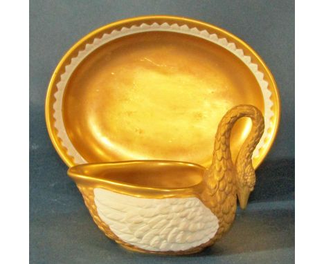 A Dresden gilt bisque porcelain swan cup and saucer (cup 8cm high, saucer 15 x 12cm) together with a pair of decorative bisqu