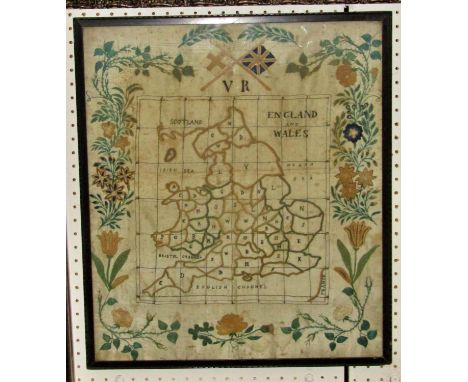A Victorian embroidered silk sampler map of England &amp; Wales, the counties defined and initialled, set within trailing flo