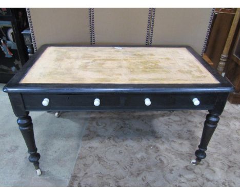 A Victorian mahogany writing table, with two frieze drawers, turned legs and casters, later painted finish, 74cm high, 134 x 