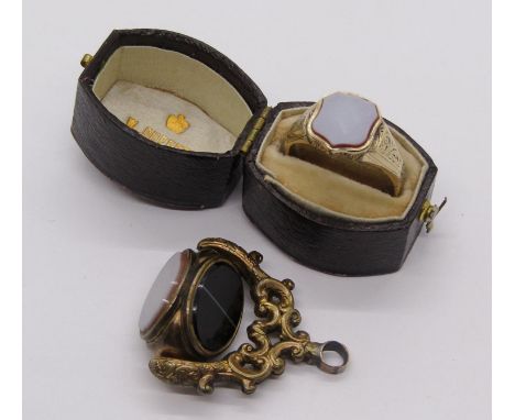 Antique yellow metal signet ring, 3.4g, contained in a period case, together with a gilt metal swivel fob (af) 