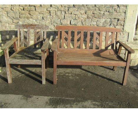 A Swan Hattersley weathered two seat garden bench with slatted seat and matching open armchair with slatted seat and back (af