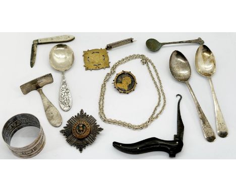 A small collection of silver cutlery, including a fruit knife with mother of pearl cover, silver gilt medallion, Scott's Guar