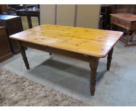 A pale pine farmhouse kitchen table, 73cm high, 184 x 102cm 