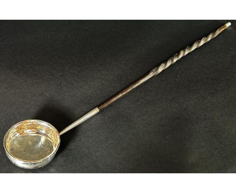 A silver metal toddy ladle with twisted cow horn handle, 42 cm long 