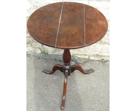 A small George III country oak snap-top tripod table, 68cm high, 56cm diameter. 