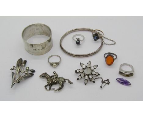 Collection of silver jewellery and a napkin ring, to include a Charles Horner hinged bangle, Chester 1958, a stylised floral 