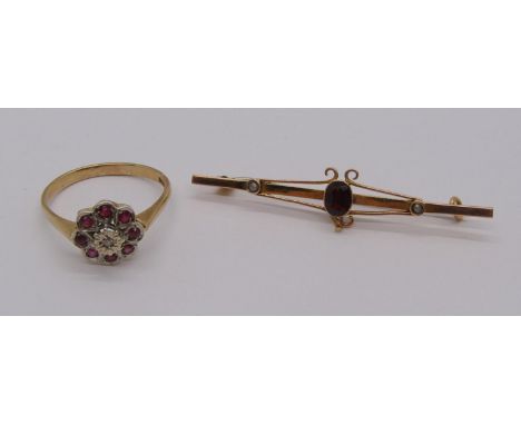 Vintage 9ct ruby and diamond cluster ring, 2.5g and an antique yellow metal brooch set with a garnet, 1.4g 