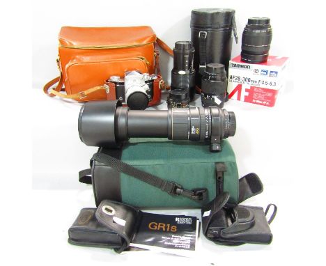 A Minolta 70-210 Zoom lens, a vintage Exacta Camera, a Nikon lens case, vintage accessories etc. 