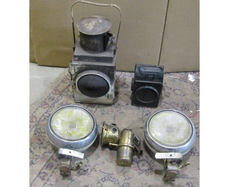 A miscellaneous collection to include railway lamps, a pair of chrome mounted 20th century automobile  headlamps, etc 