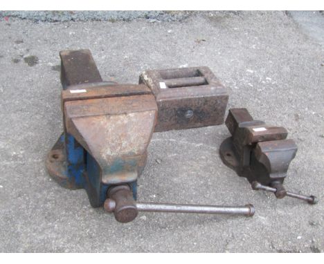 Two bench vices together with cast iron weight (3) 