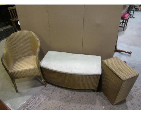 Three Lloyd Loom items with a gold painted finish, to include a chair, ottoman and laundry box together with a rectangular oc