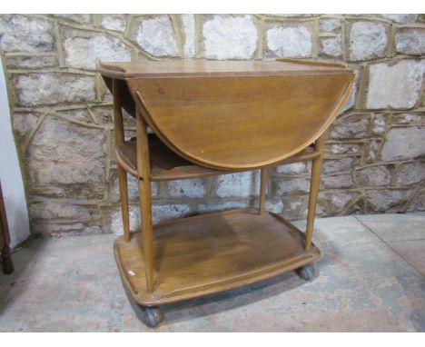 A pale Ercol tea trolley, 75cm high. 