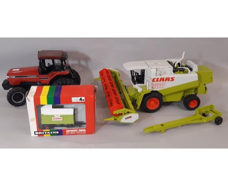 Model farm vehicles including a boxed Silage tipping trailer by Britians, an International tractor (unbranded) and a CLASS co