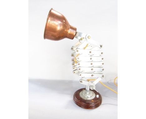 A late 20th century adjustable Scissor Desk Lamp, with a copper shade 