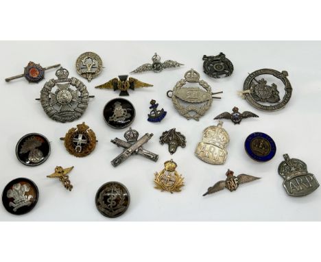 A collection of silver and other military cap badges, lapel badges, etc, some with tortoiseshell backing, others with enamel 