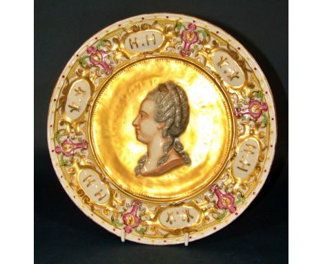 A Capodimonte portrait charger, possibly depicting Marie de Medici, within gilt field and borders initiated ‘H.H’, blue devic