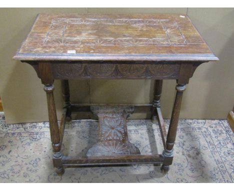 A carved oak side table, 73cm high, 80 x 50cm 