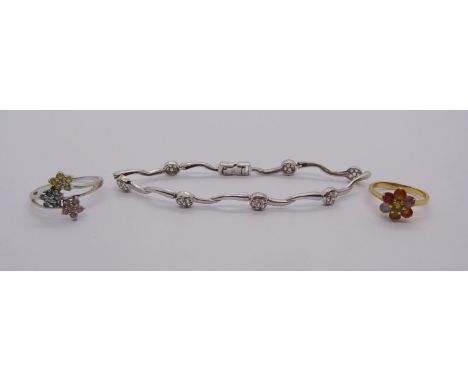 Group of gold jewellery comprising an 18ct vari-coloured sapphire cluster ring, 3.1g, a similar 10k white gold example, 2.1g 