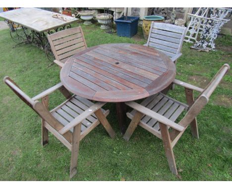 A Clarecraft contemporary weathered teak garden table with circular slatted top 120 cm diameter together with a set of four m