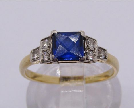 Art Deco 18ct ring with platinum setting, set with a French-cut sapphire between stepped diamond set shoulders, size L, 2.3g 