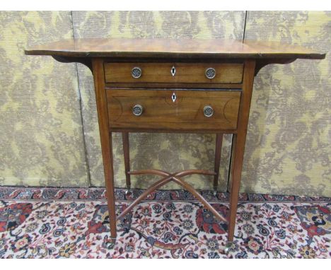 A regency mahogany ladies sewing table, two frieze drawers enclosed within drop leaves raised on square tapered legs with X s