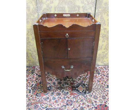A Georgian mahogany tray top commode with pierced gallery with enclosed front on moulded supports, 55 cm wide 