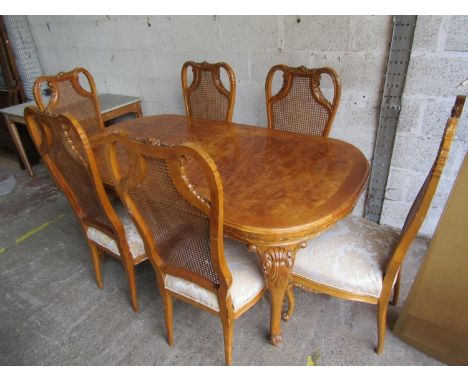 A walnut and burr walnut dining room suite, the D end table raised on cabriole supports, together with a set of six dining ro