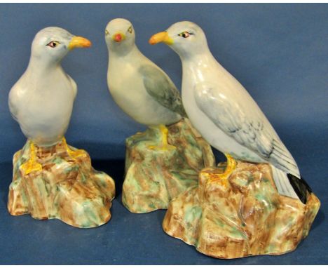 Three Radford pottery models of standing seagulls, each 22 cm high, together with a novelty three piece figural tea set compr