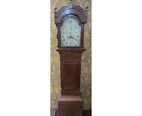 A regency mahogany longcase clock with broken arch painted dial with shell spandrels, subsidiary calendar and secondary dials