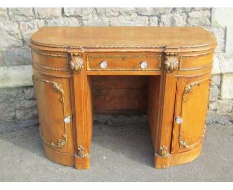 A 19th century pine dressing table of rounded rectangular form, with moulded gilt borders, 76cm high, 108 x 54cm 