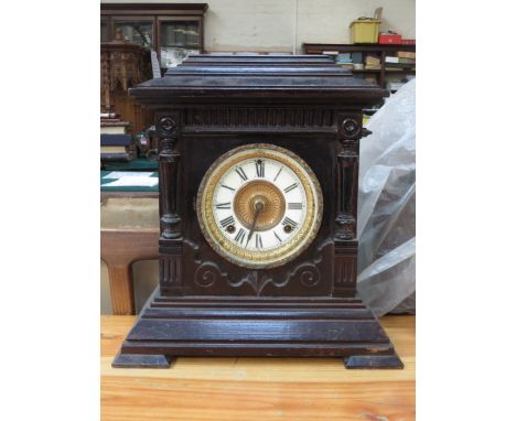 EBONISED AND GILDED MANTEL CLOCK WITH ENAMELLED DIAL