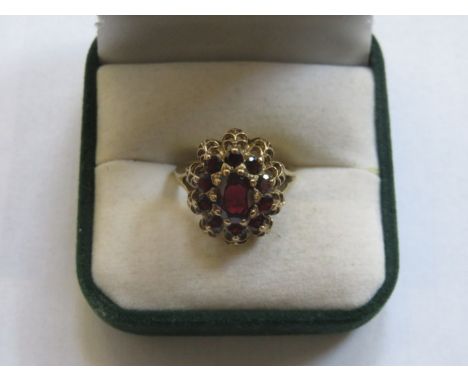 9ct GOLD DRESS RING SET WITH RUBY COLOURED STONES 
